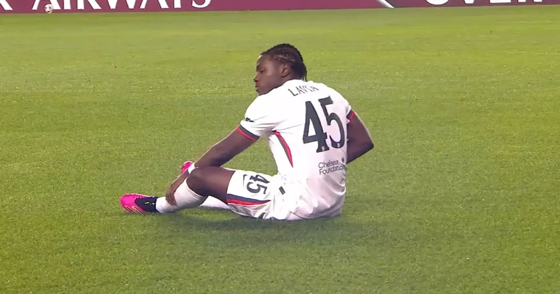 Romeo Lavia sits on the turf after picking up an injury against Qarabag.