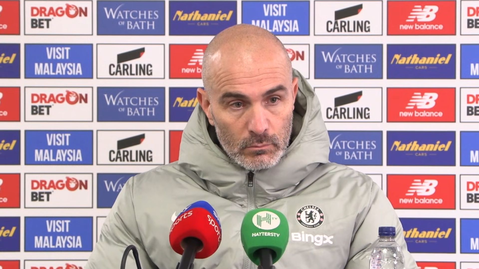 Enzo Maresca looks unhappy in a press conference after a win.