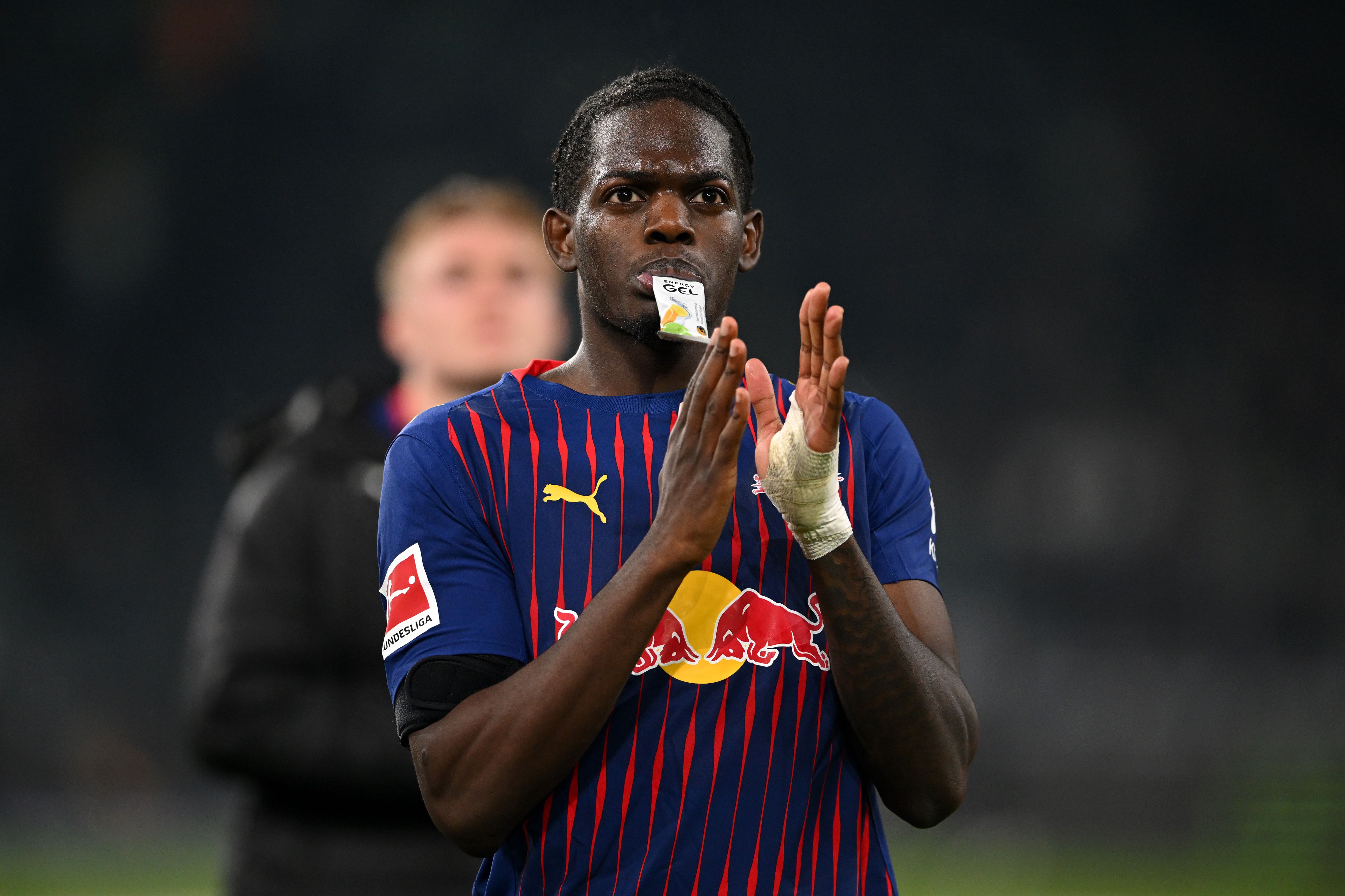 Castello Lukeba applauds the RB Leipzig fans.