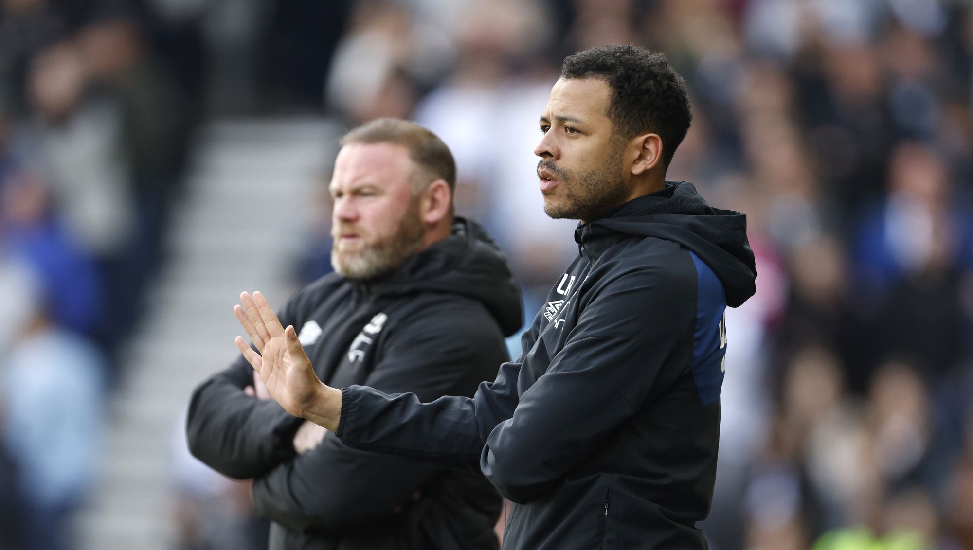 Liam Rosenior coaches alongside Wayne Rooney at Derby County.