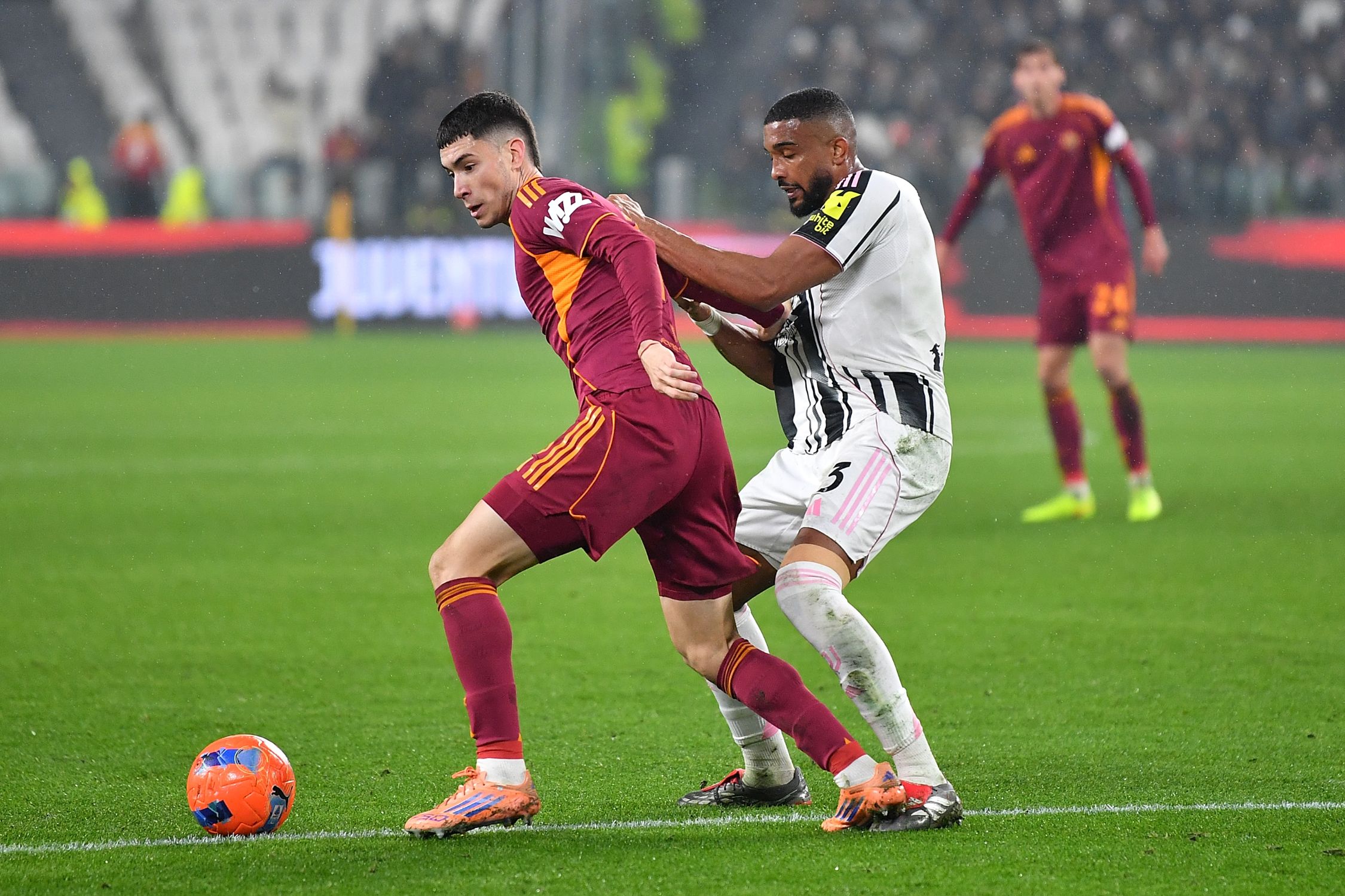 Gleison Bremer battles for possession against Roma.