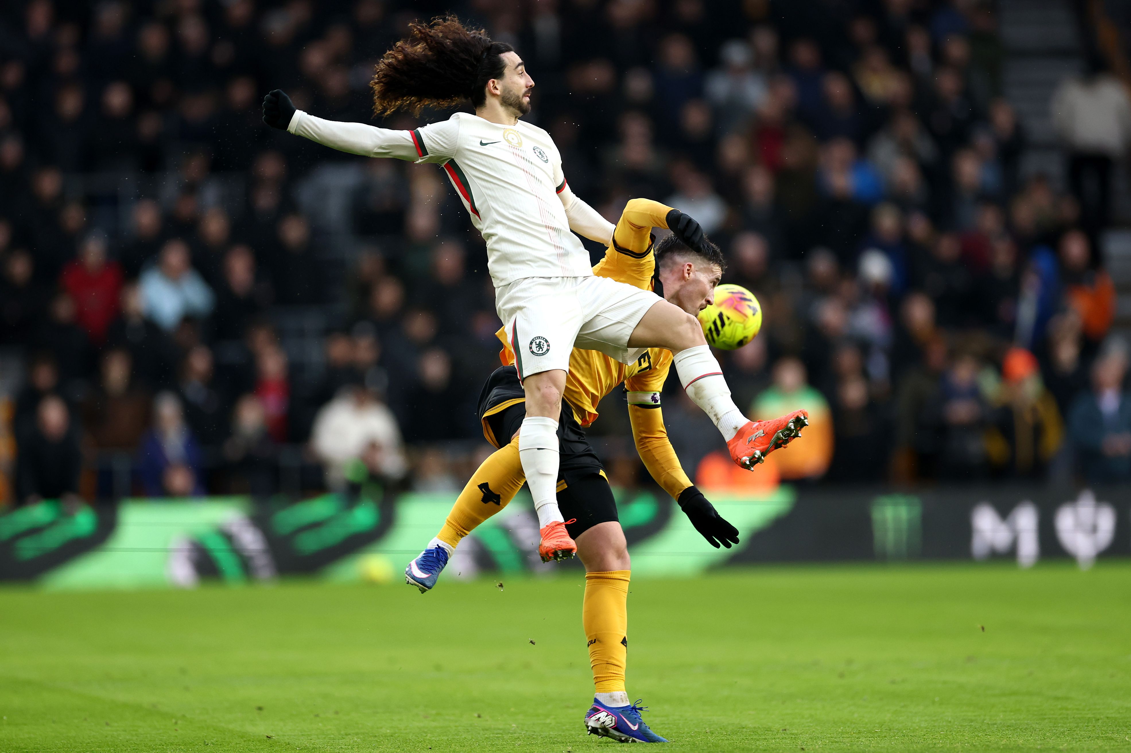 Marc Cucurella battles for possession against Wolves.