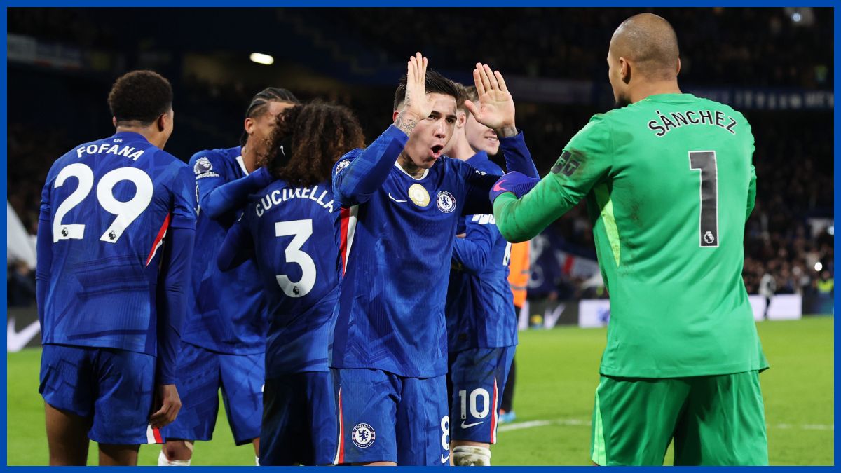 Chelsea players celebrate at final whistle.