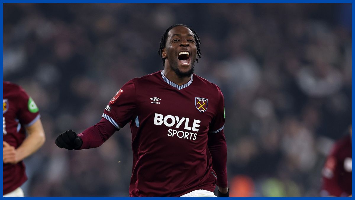 Axel Disasi playing football.