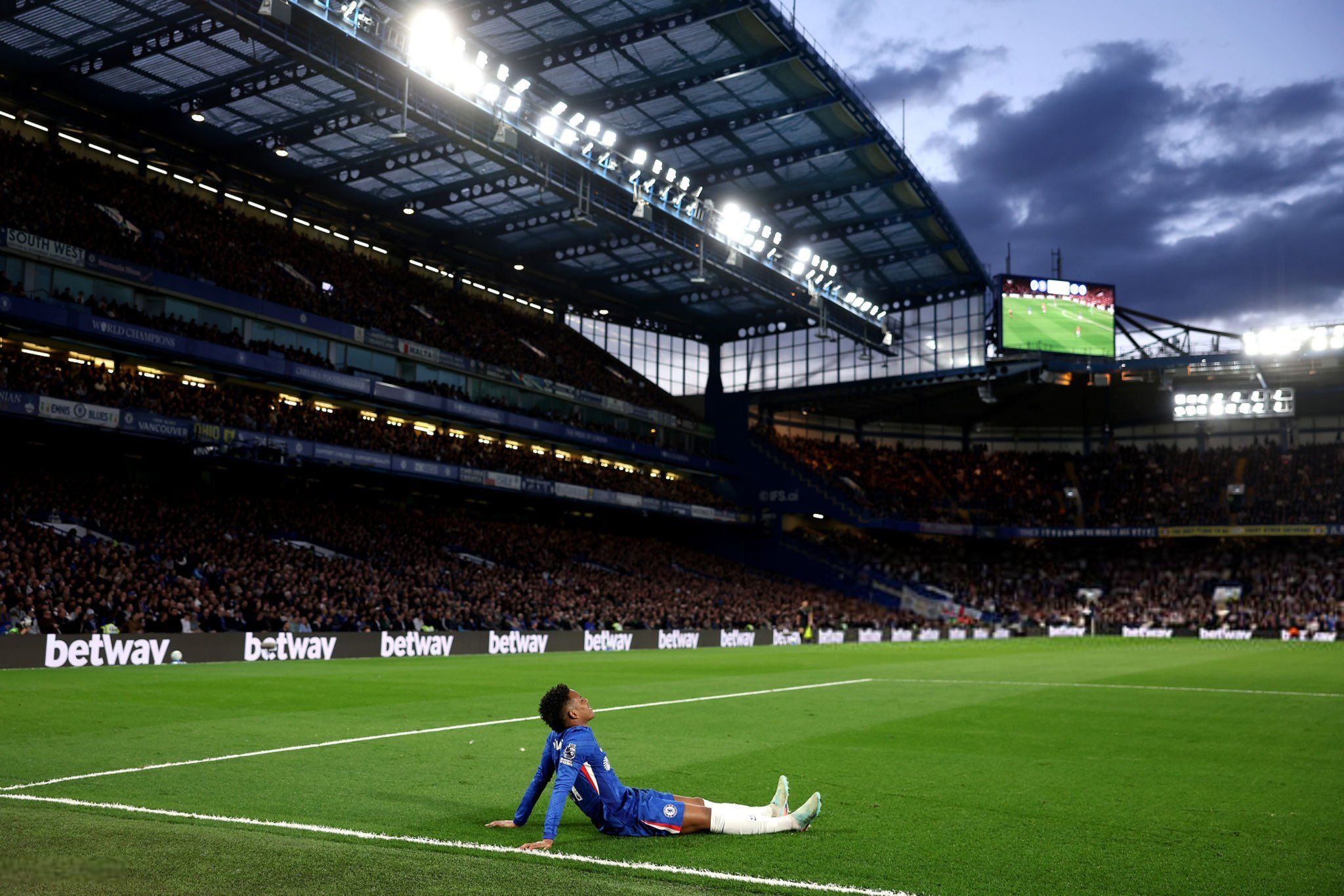 Estevao lies injured for Chelsea.