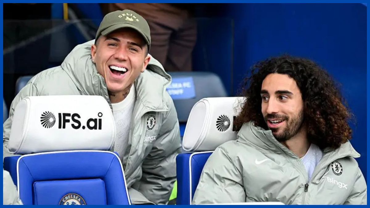 Marc Cucurella and Enzo Fernandez joke on the sideline.